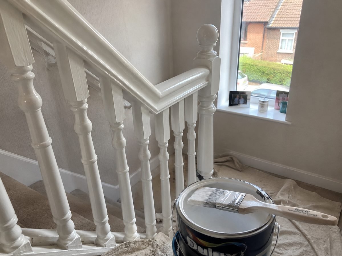 Staircase with charcoal spindles and white handrail